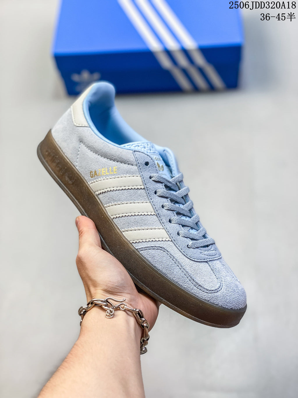 Light blue Adidas Gazelle 90 sneaker with cream stripes and a dark gum-style sole