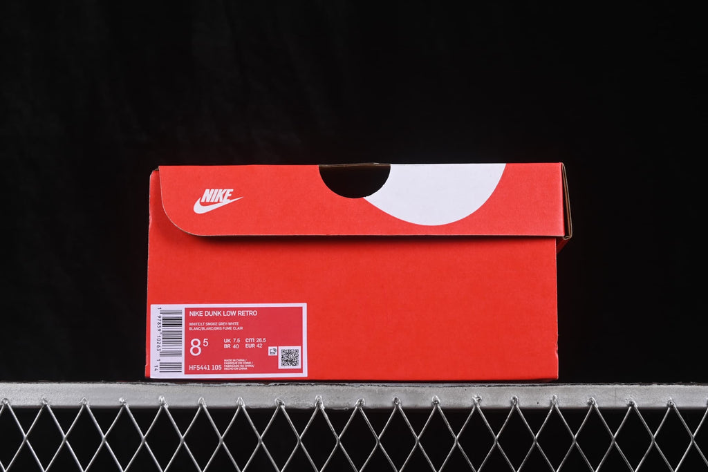 Red Nike shoe box showing Nike Dunk Low labeling, style code HF5441 105, and a photographed size label of EU 42.