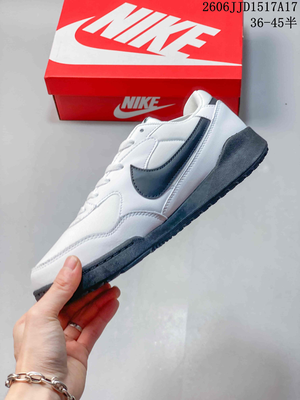 Side view of a white Nike Terra Manta sneaker with a dark gray Swoosh and sole.