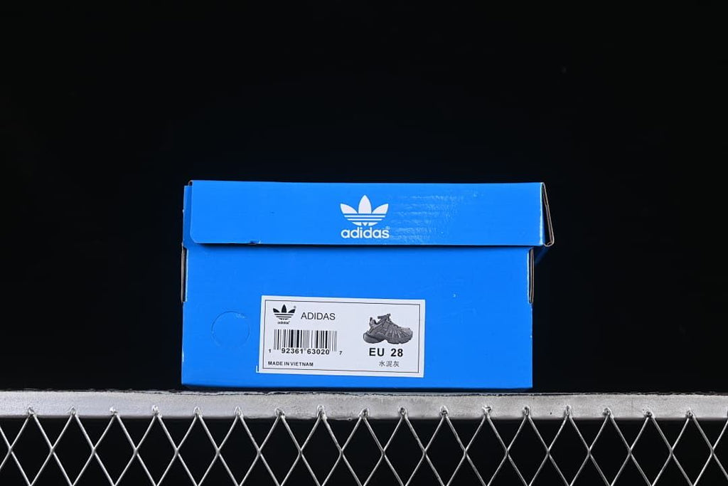 Blue adidas shoe box labeled EU 28 beside a product image.