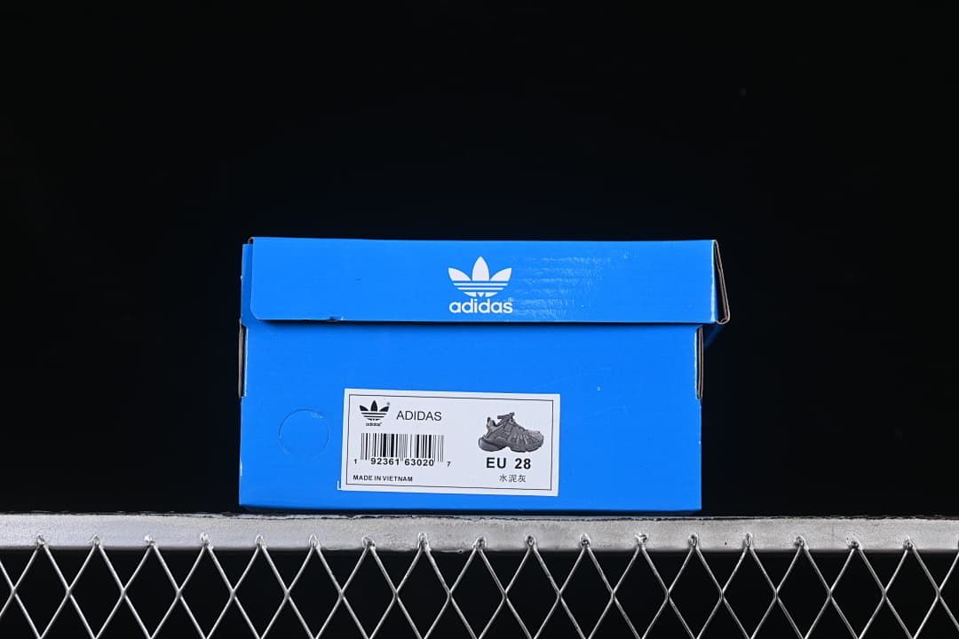 Blue adidas shoe box labeled EU 28 beside a product image.