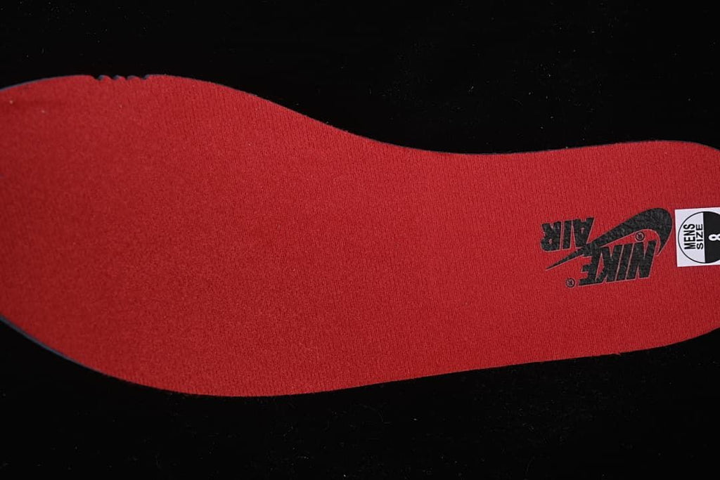 Red insole with Nike Air branding and a visible size label