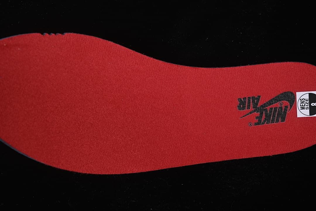 Red insole with Nike Air branding and a visible size label