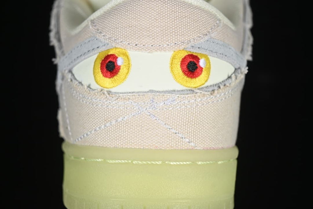 Rear view with embroidered eye graphics and translucent outsole