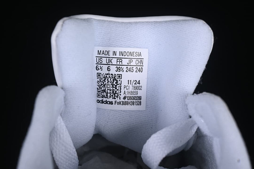 Sneaker tongue size label showing US 6.5, UK 6, FR 39 1/3, JP 245 and CHN 240