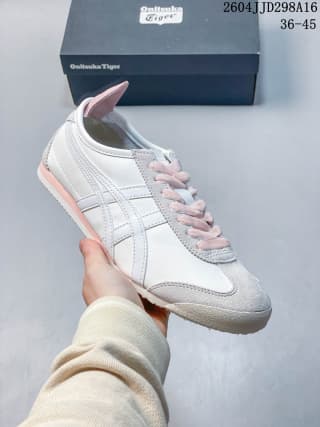 White Mexico 66 sneaker with pale pink accents on the side stripes, laces, and heel.