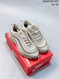 Pair of beige Nike Air Max 97 sneakers shown from above on a red shoe box
