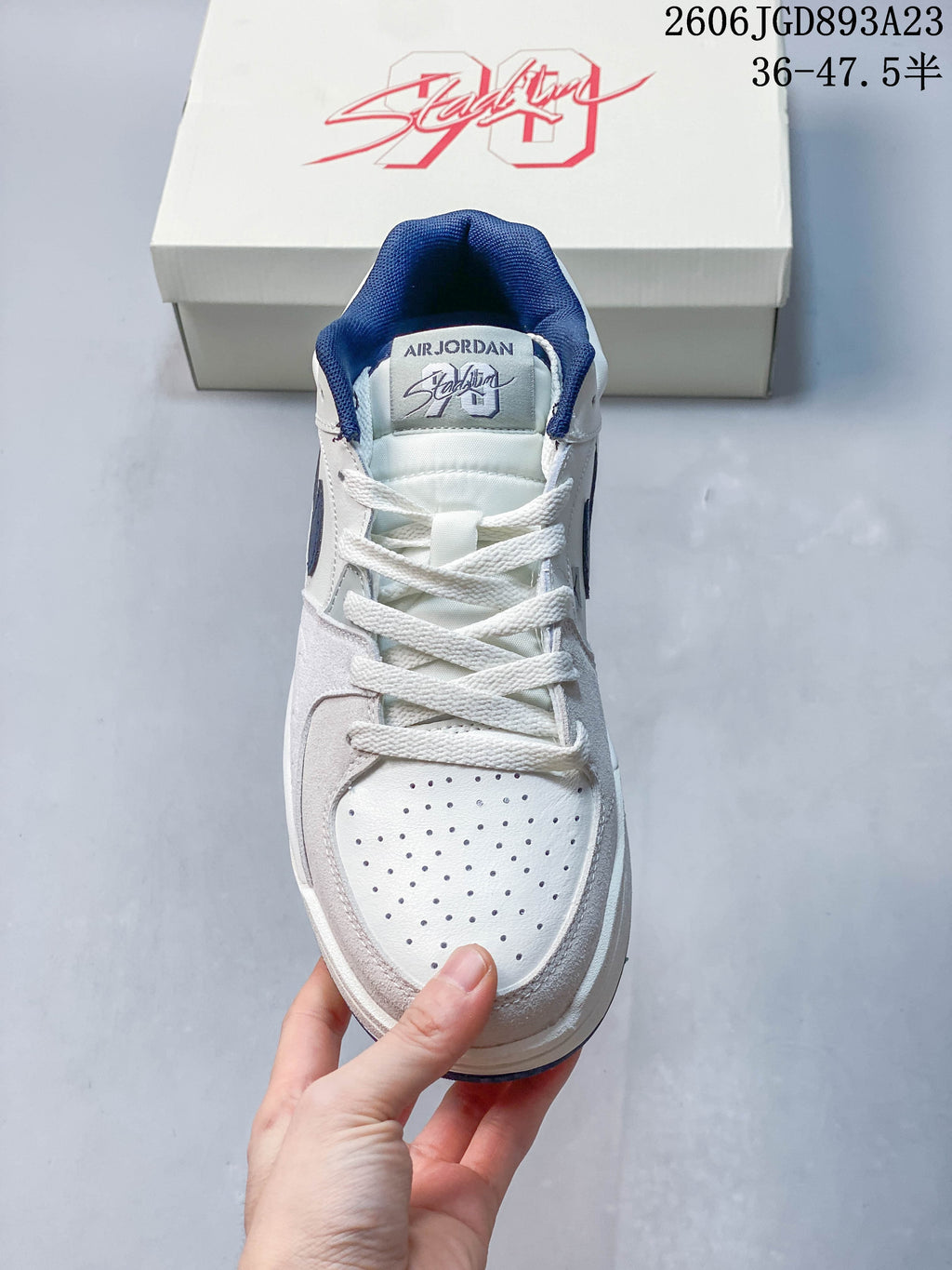 Front view of the sneaker showing its perforated toe and lace-up design