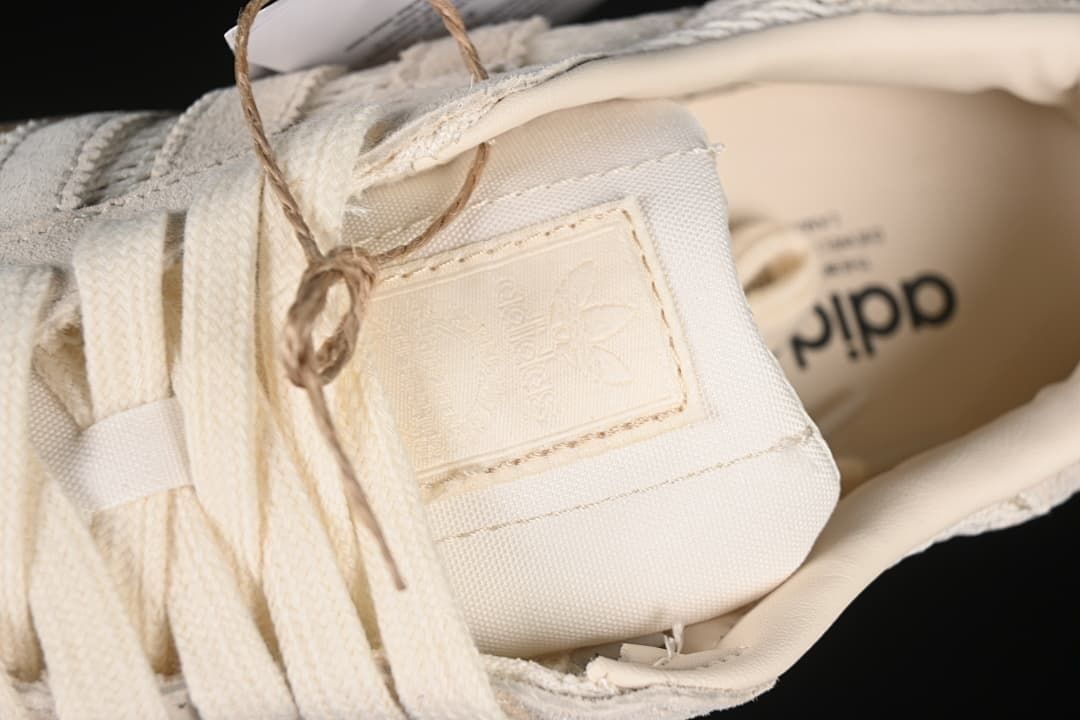 Close-up of the tongue branding patch and cream laces.