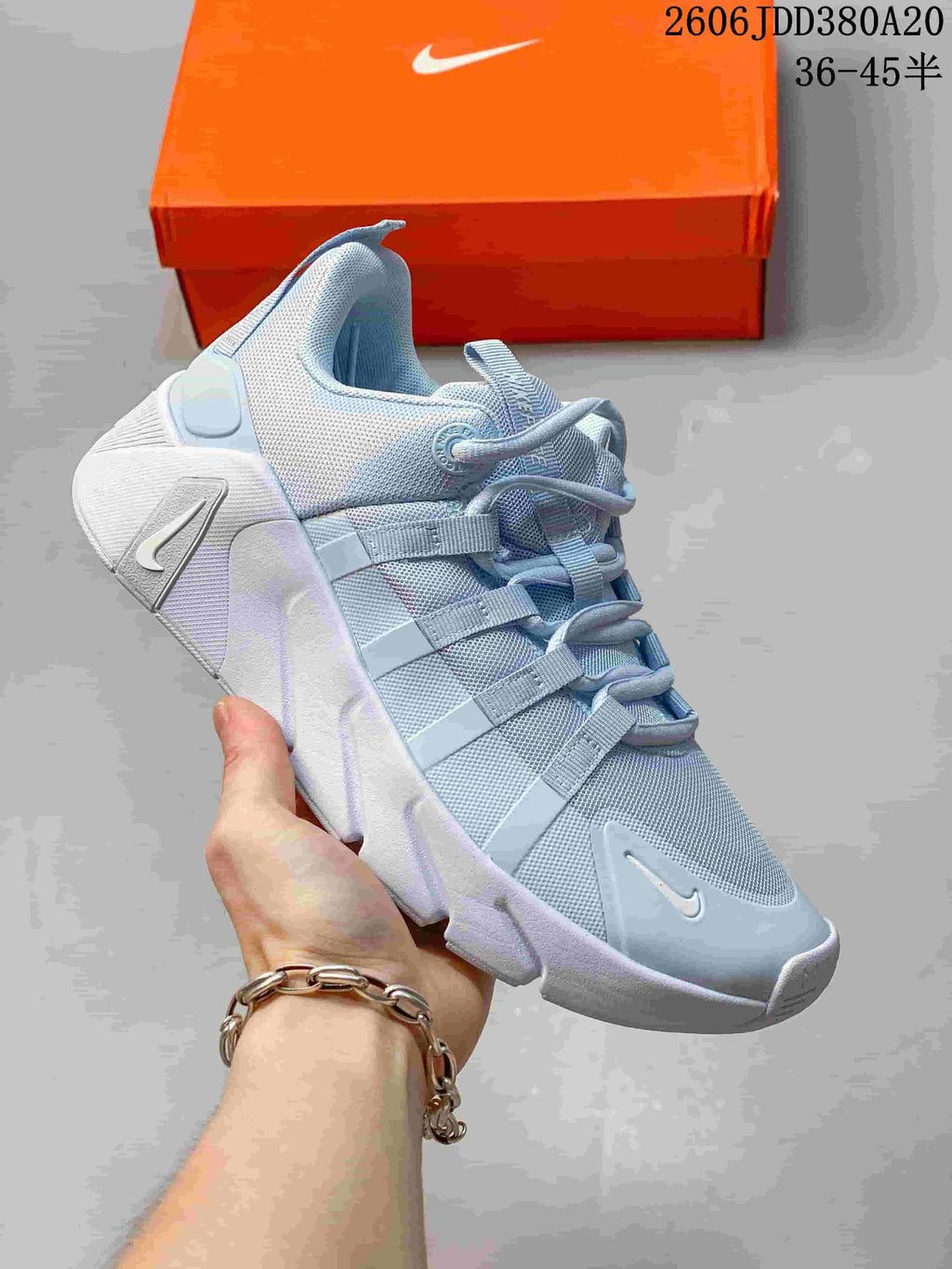 Light gray-blue Nike Free Metcon 7 shoe, angled view