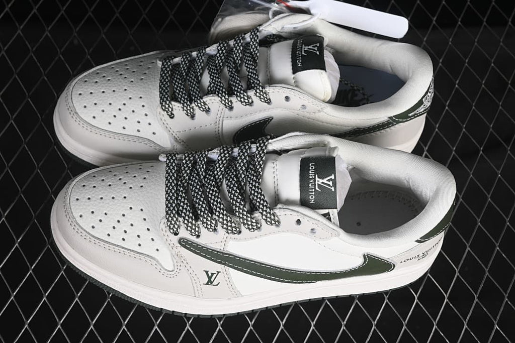 Pair of off-white and dark green low-top sneakers viewed from above, showing perforated toes and patterned laces