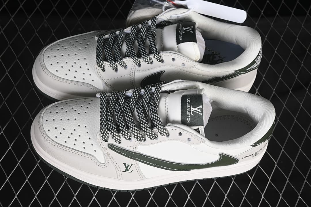 Pair of off-white and dark green low-top sneakers viewed from above, showing perforated toes and patterned laces