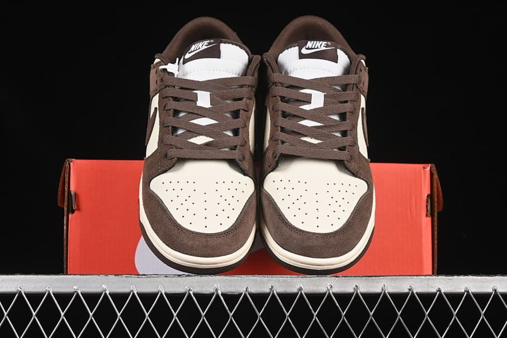 Front view of the pair showing perforated toes and brown laces