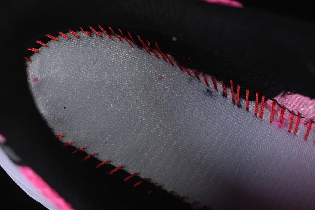 Close-up of stitching and interior lining on the sneaker.
