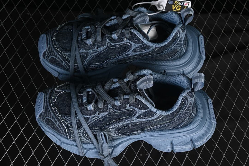 Pair of blue denim-look sneakers shown from above
