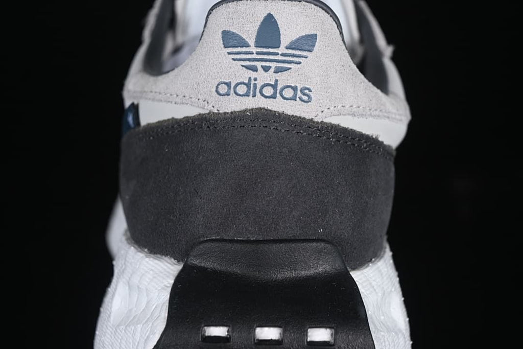 Rear view showing adidas Trefoil branding and charcoal heel panel