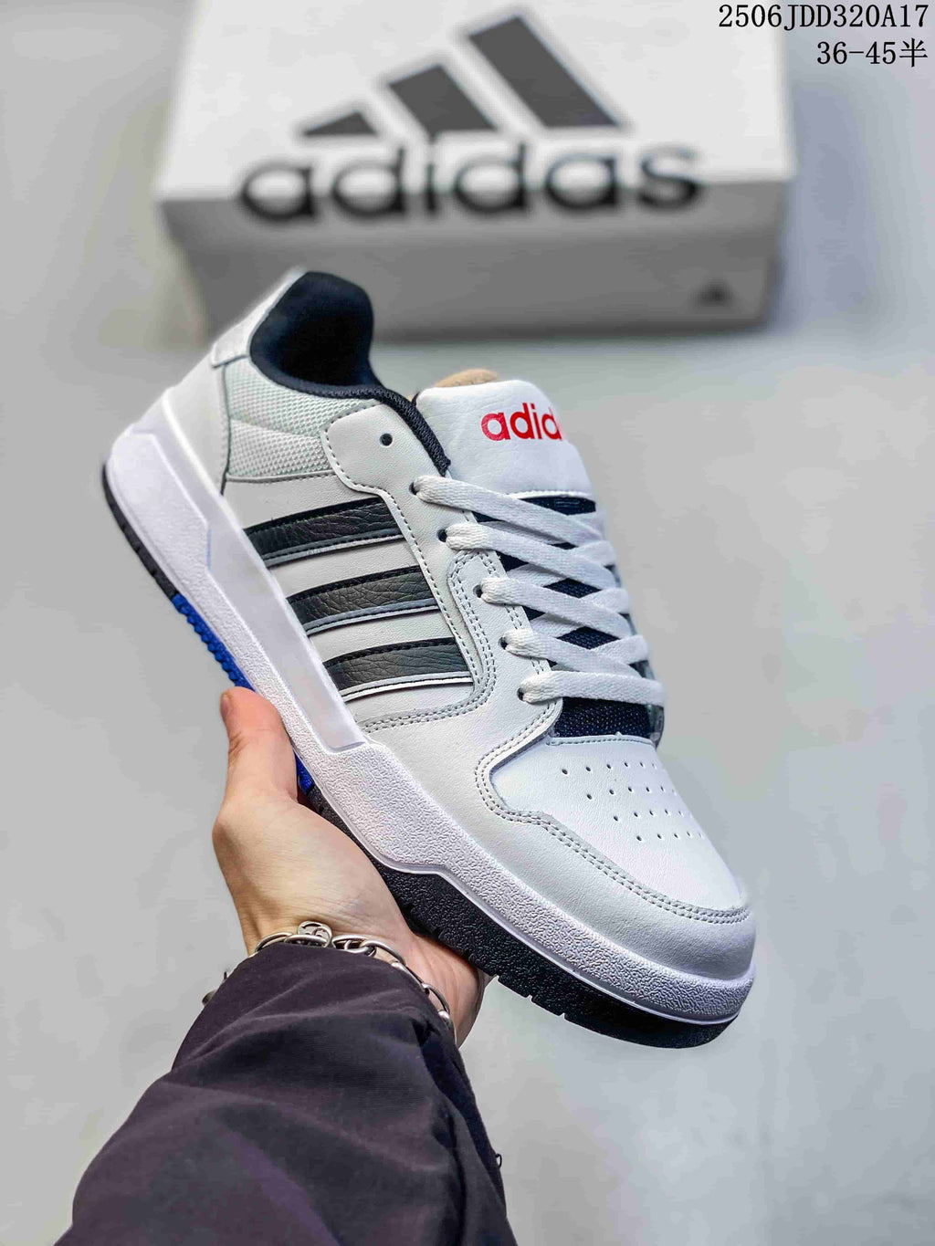 White adidas Entrap sneaker with black side stripes, dark lining, and a contrasting outsole