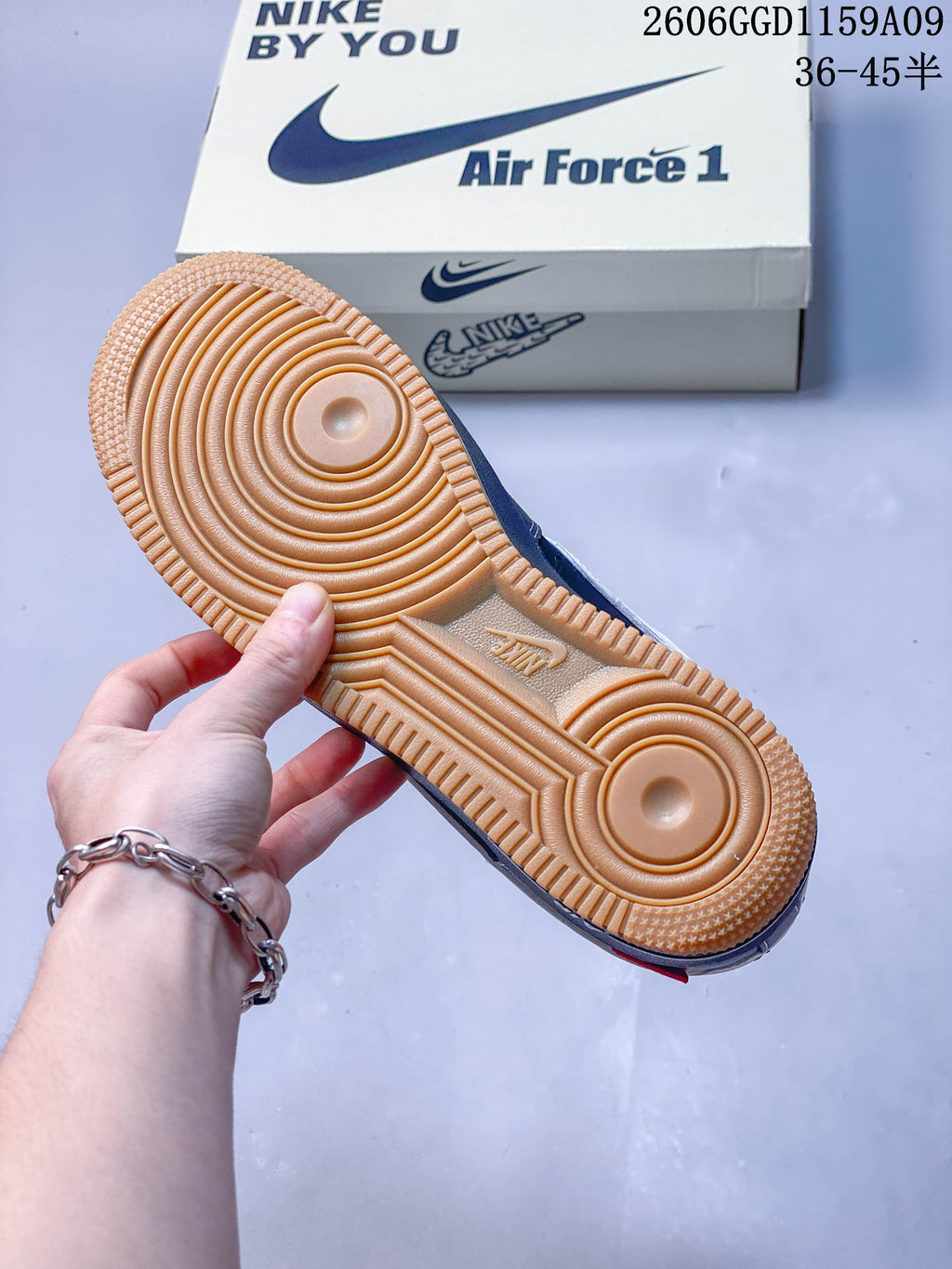 Close-up of the gum-colored outsole and circular tread pattern.