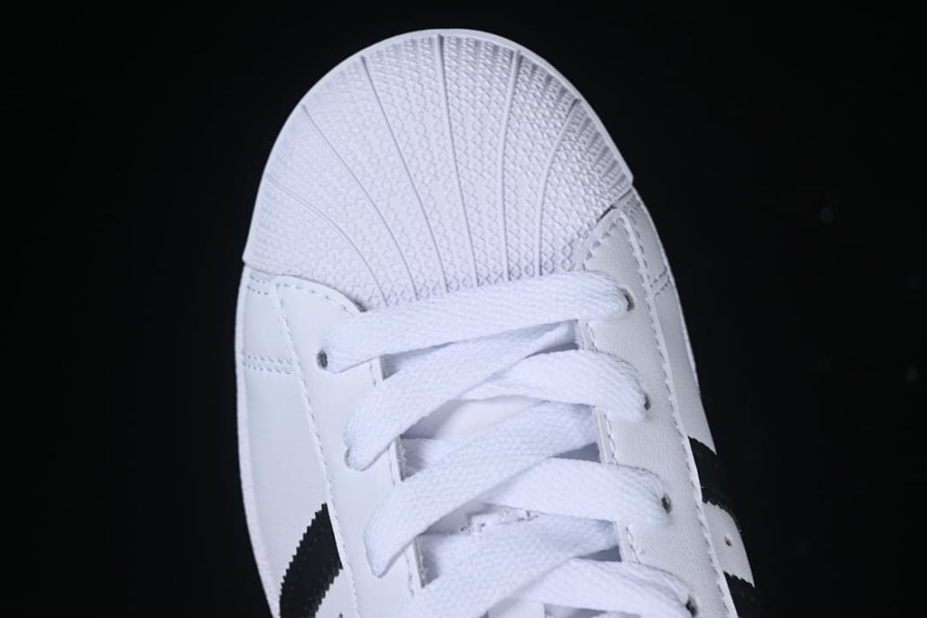 Top-down close-up of the shell toe and laces