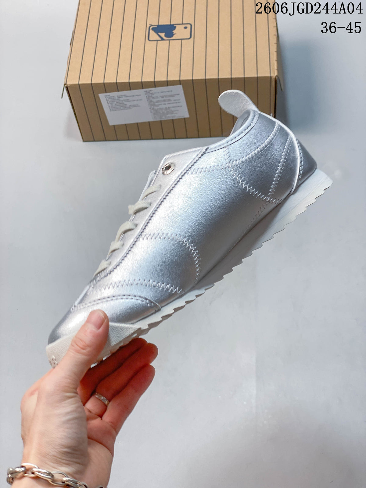 Side view highlighting the silver stitched panels and low-profile white sole