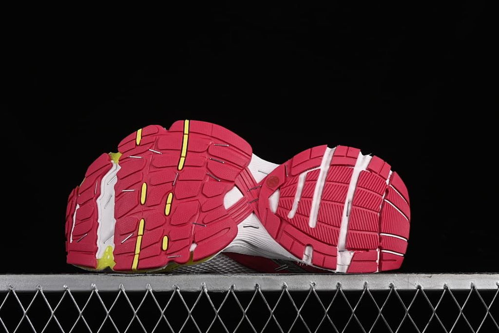 Underside view showing the pink tread and segmented outsole pattern