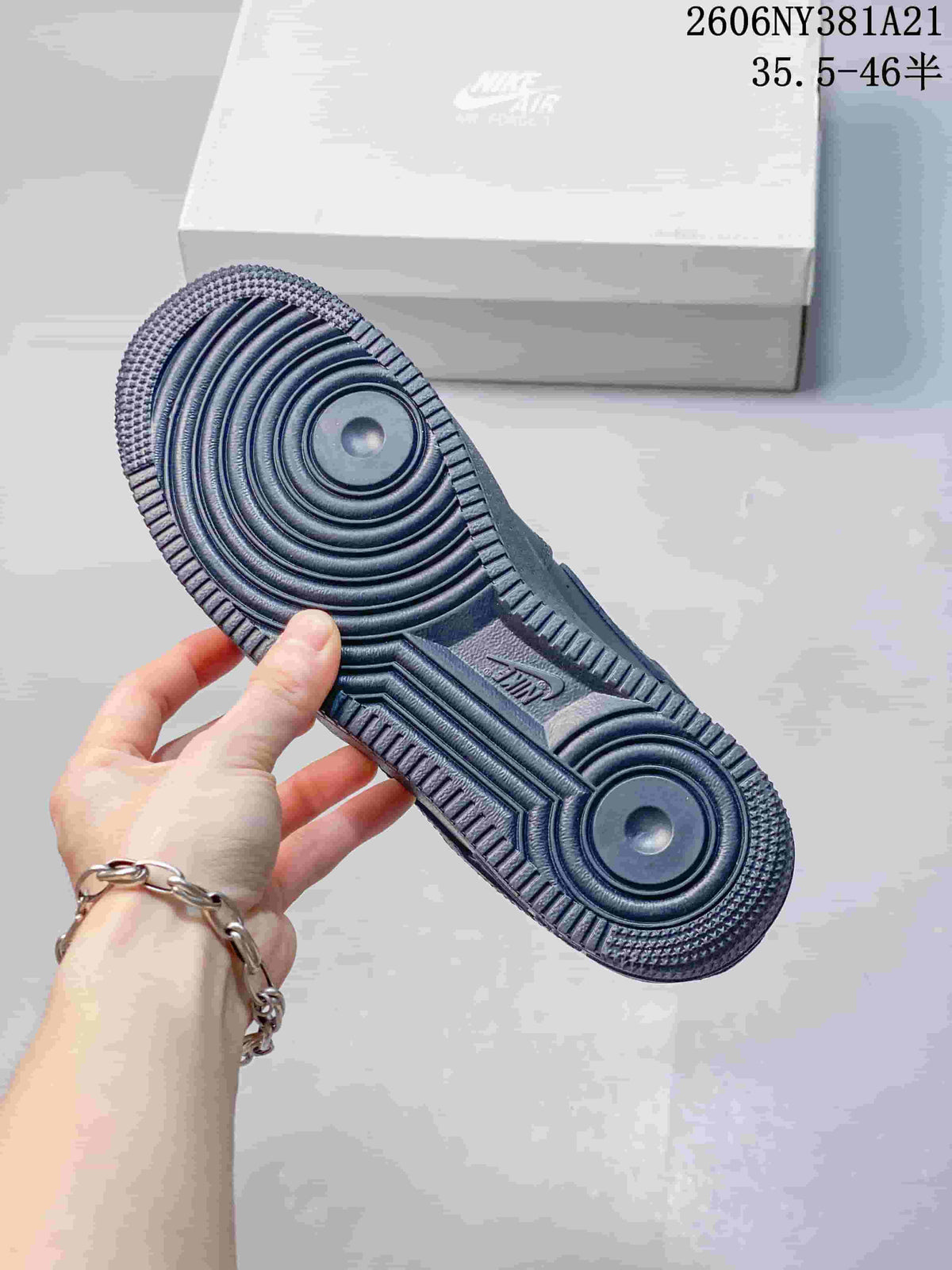 Textured outsole of a dark blue low-top sneaker