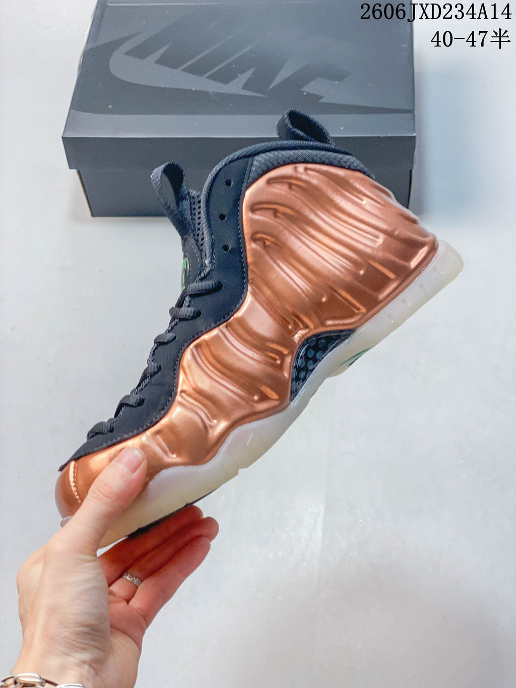 Side profile showing the sculpted copper-toned panels and dark lacing area