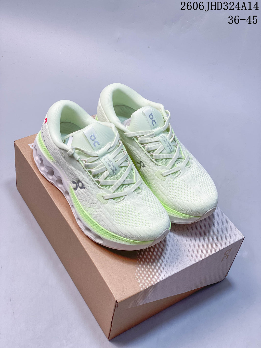 Pair of white shoes with pale green accent details