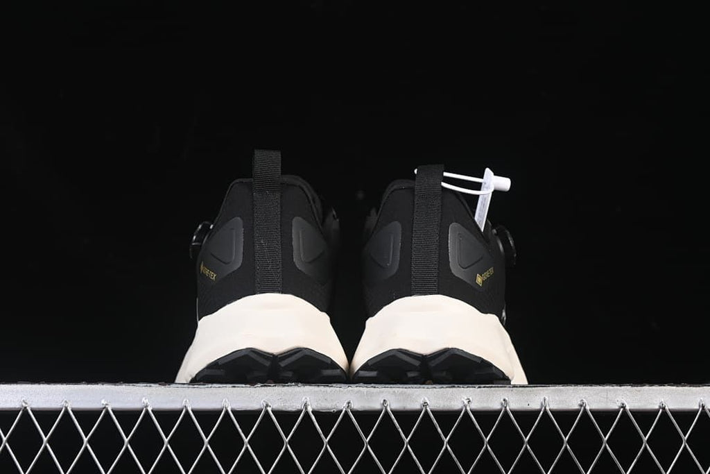 Rear view of the pair showing heel tabs and outsole edges.