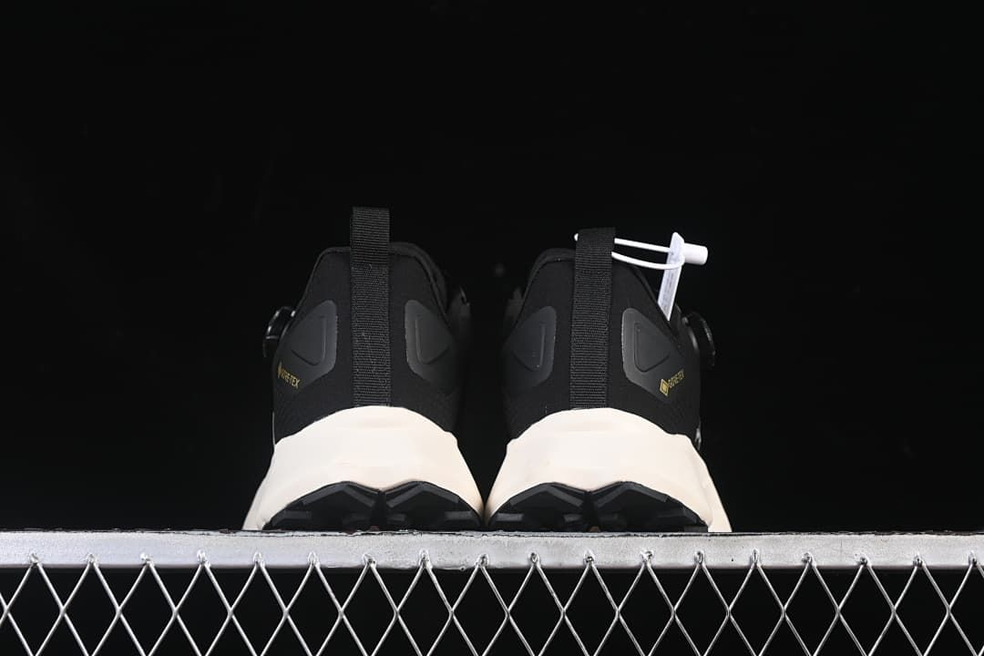 Rear view of the pair showing heel tabs and outsole edges.