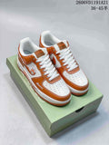 Pair of brown-and-white Nike Air Force 1 Low-style LABUBU sneakers on a green printed box