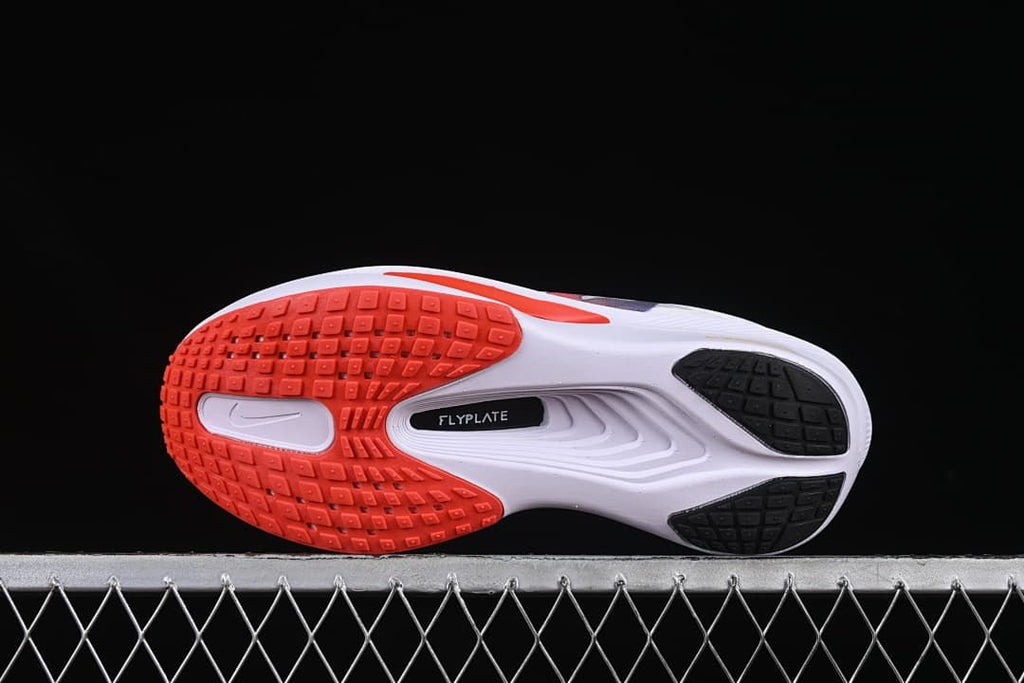 Underside view showing the red and black outsole sections
