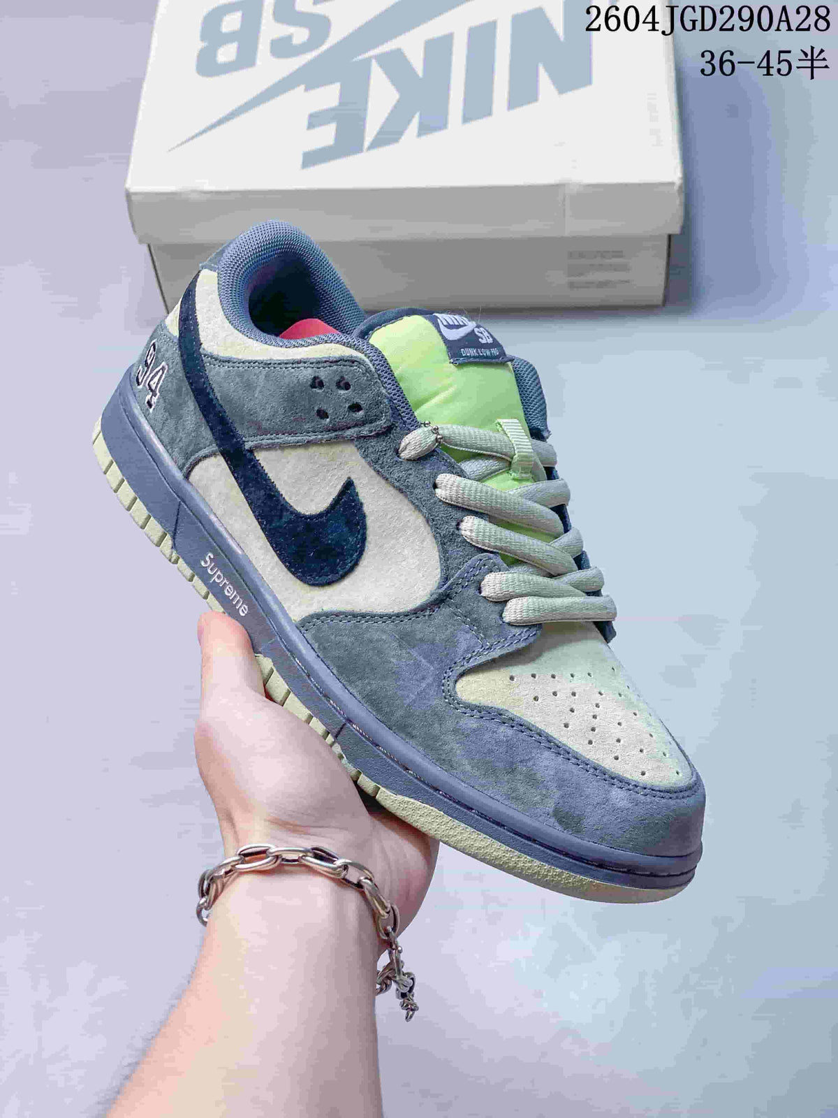 Gray and pale green low-top sneaker with navy detailing