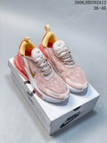 Pair of pale pink Nike Air Max 270 shoes with gold-tone accents on a shoebox