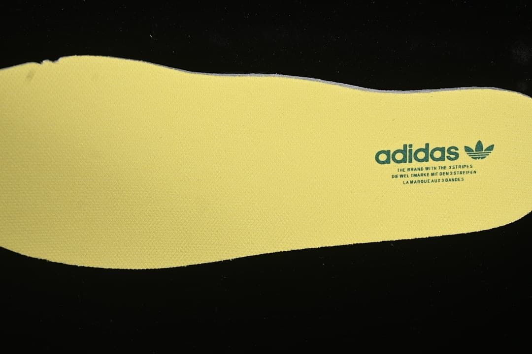 Yellow insole with adidas branding