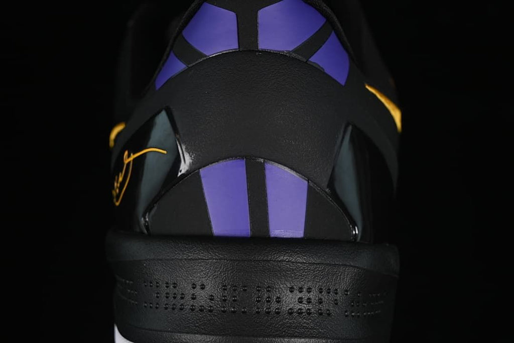 Rear view showing purple heel panels and black heel structure