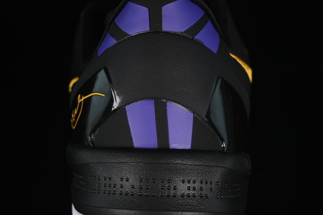 Rear view showing purple heel panels and black heel structure