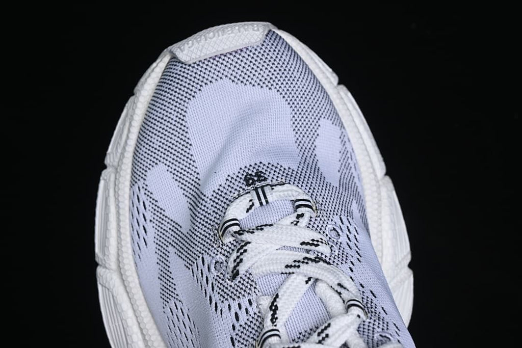 Top-down close-up of the patterned sneaker upper and laces.