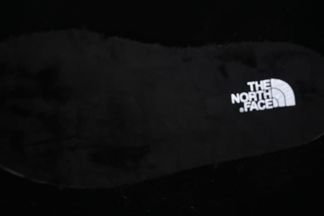 Close-up of the black footbed with The North Face logo