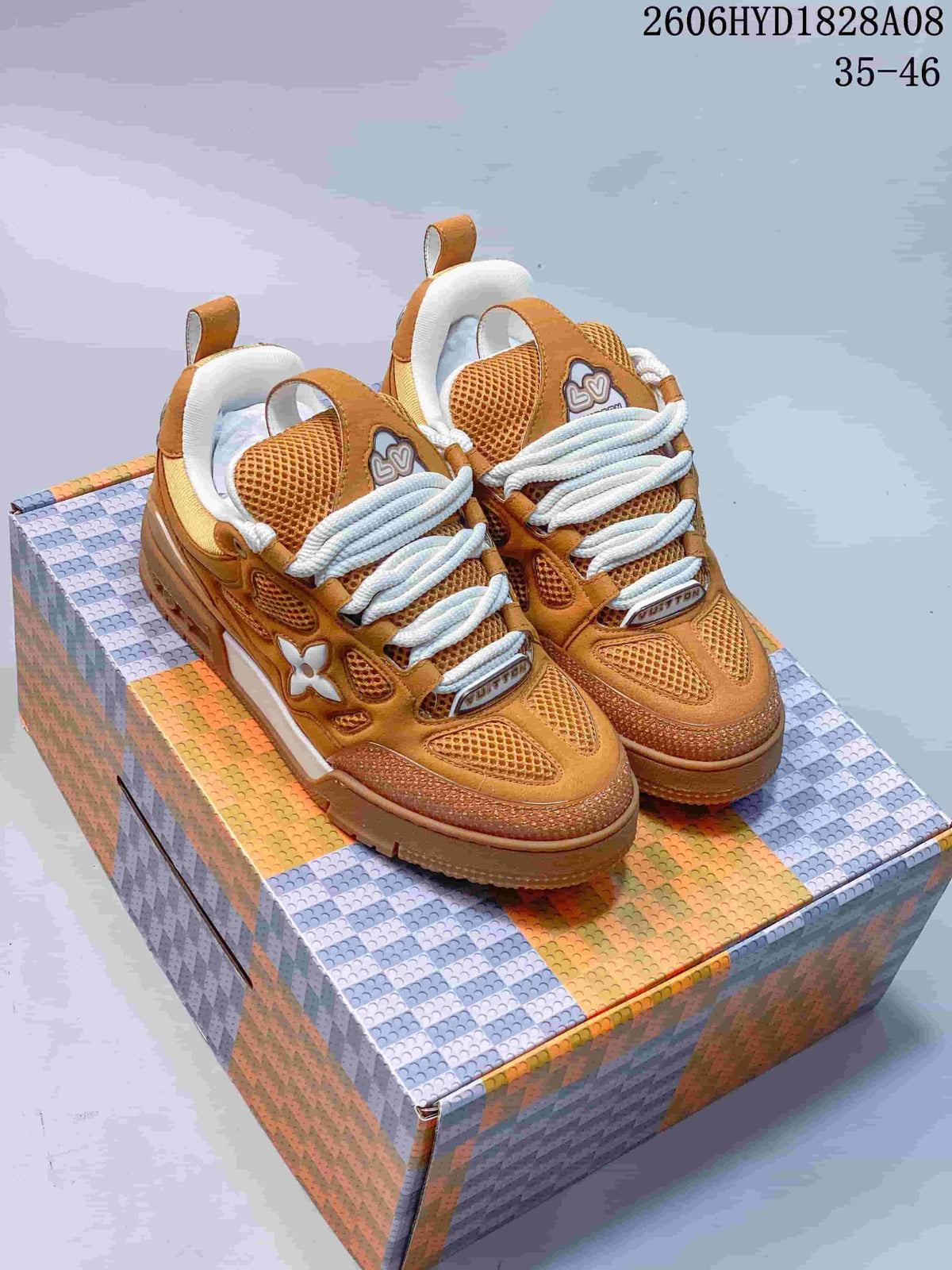 Pair of brown mesh-panel trainer-style sneakers with white laces and contrasting side accents