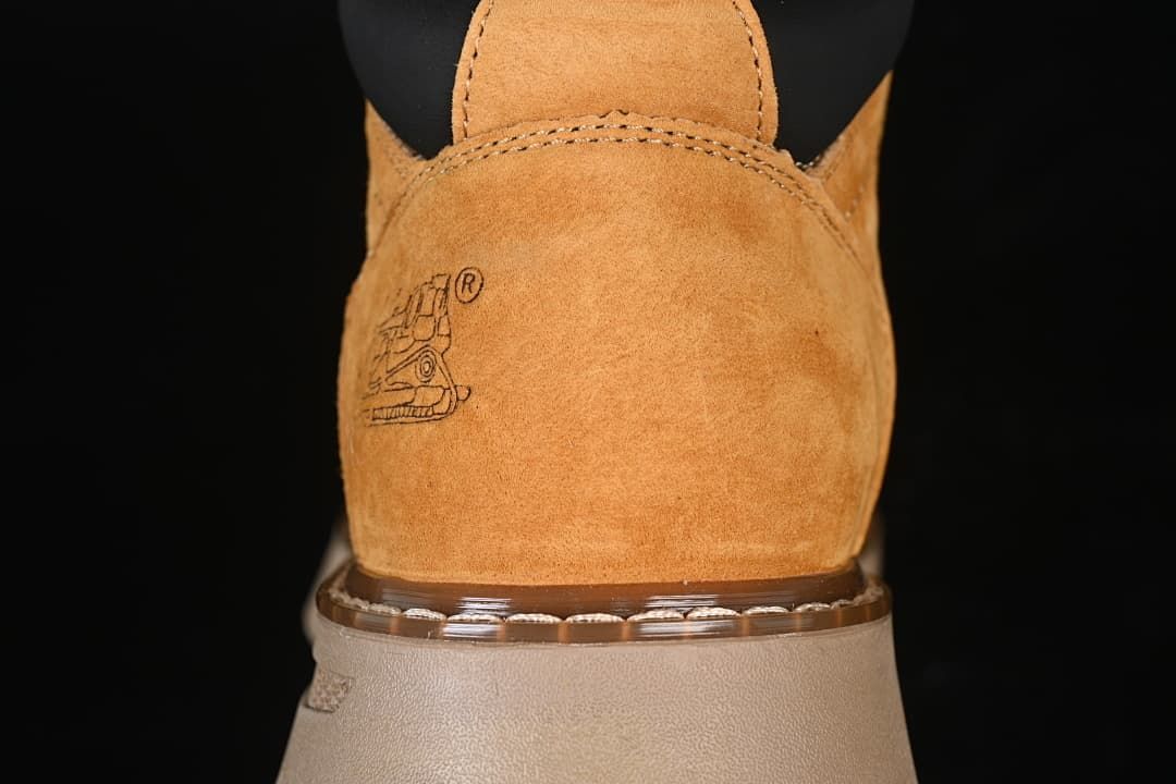 Rear view highlighting the wheat-colored heel and padded black collar