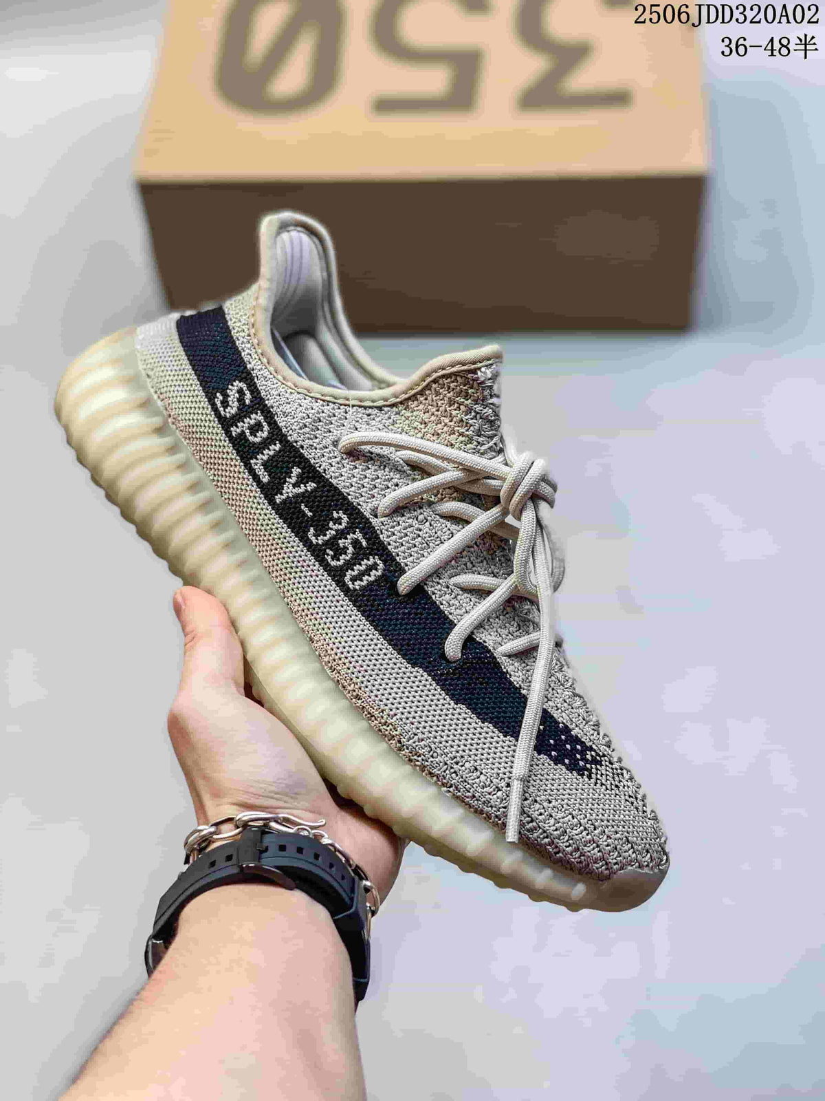 Light gray knit low-top sneaker with a dark side stripe and a pale ribbed sole.
