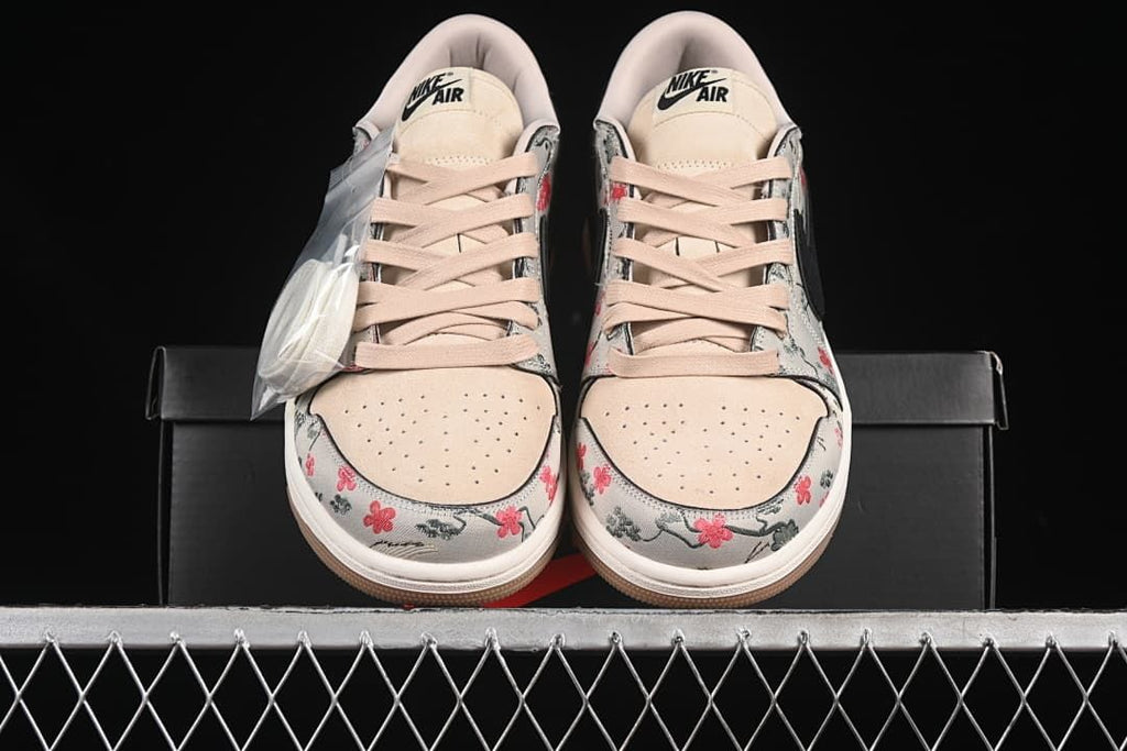 Front view of the pair showing the laces and patterned toe area
