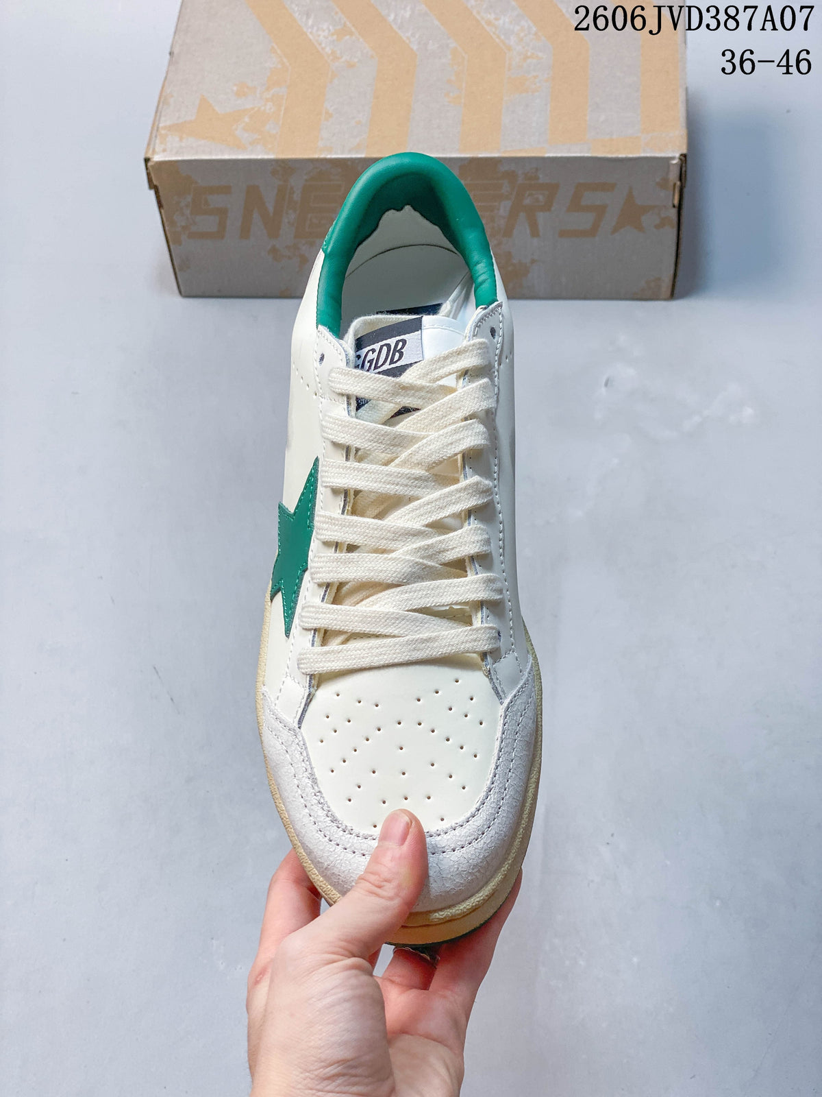 Top view showing the laces, perforated toe, and green collar.
