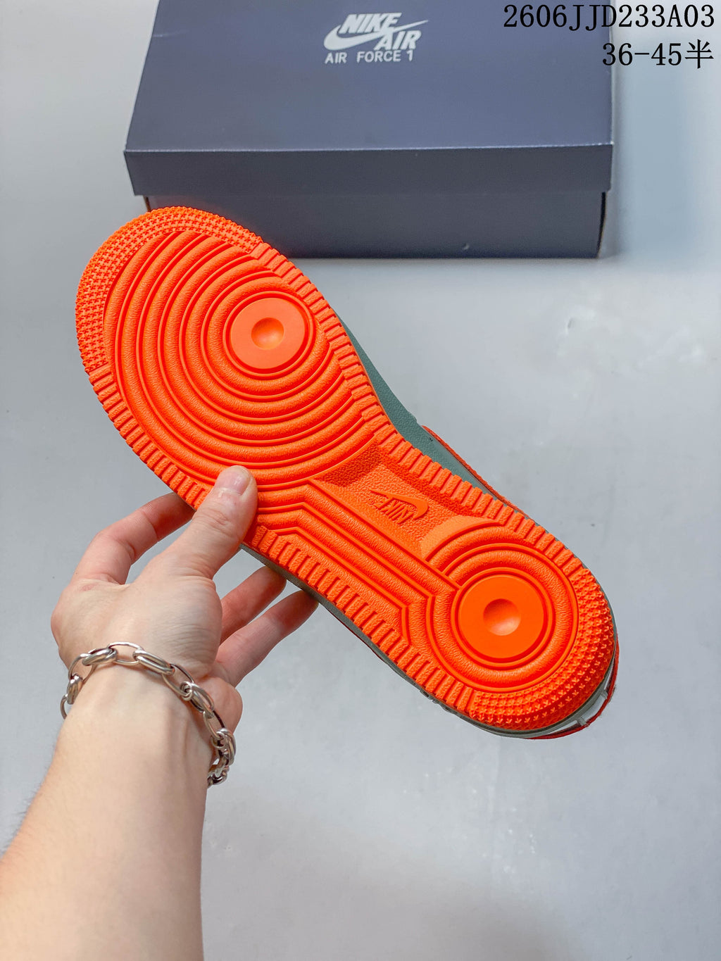 Bright orange outsole of a Nike Air Force 1 ’07 sneaker