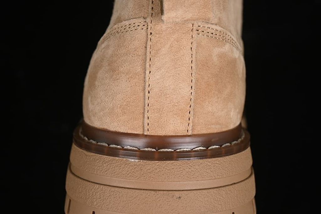 Rear view showing the boot heel, stitching and layered sole