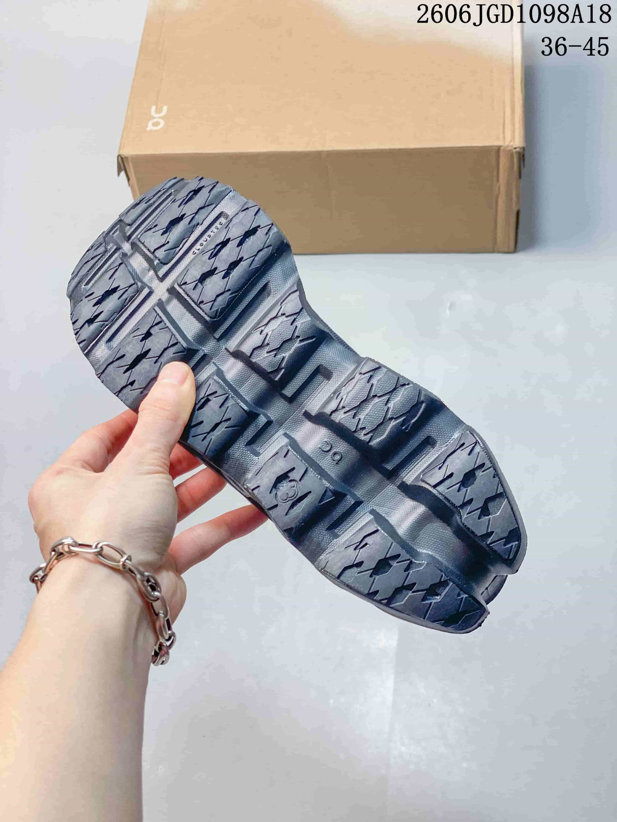 Close-up of the shoe outsole showing its patterned tread and sculpted sections.