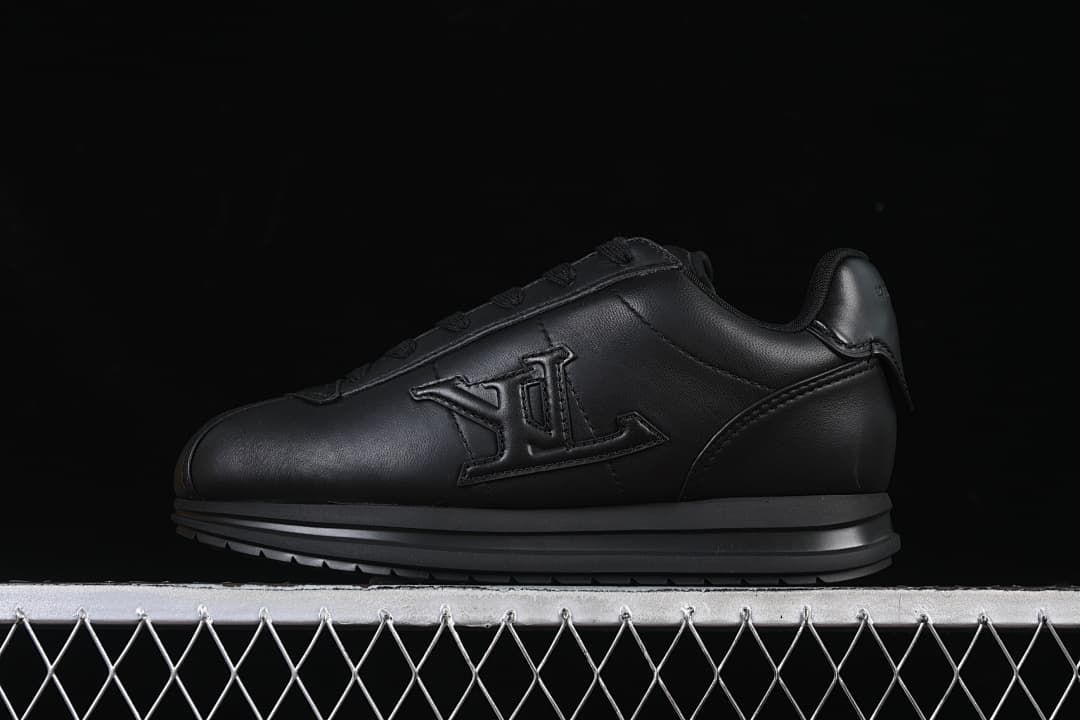 Black low-top sneaker shown from the side