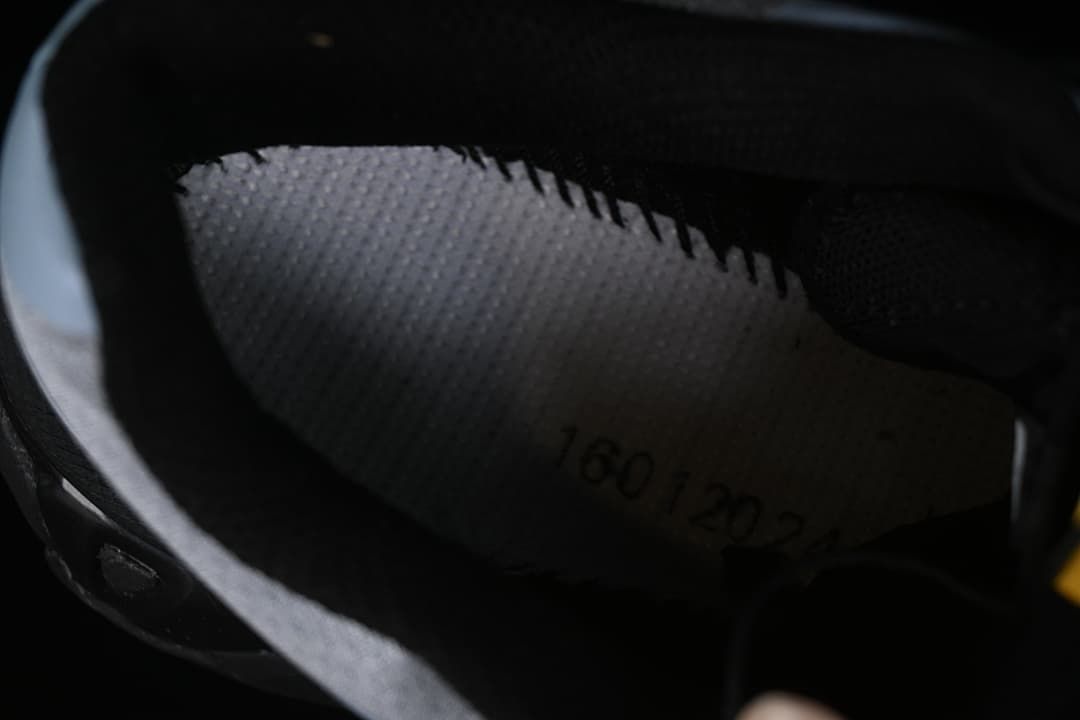 Interior view of the shoe showing a printed insole marking.