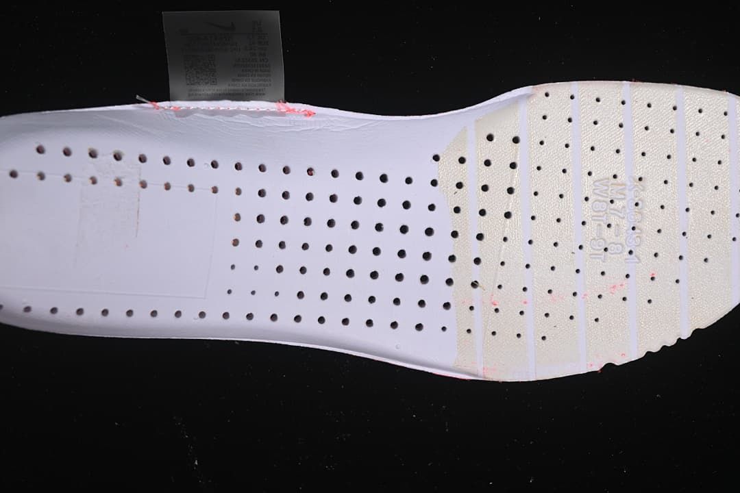 Close-up of the perforated white shoe insert.